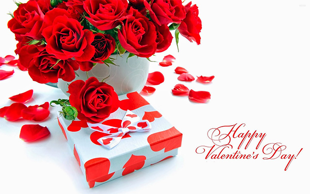 Beautiful Valentine's Day picture showcasing flowers and a box of chocolates