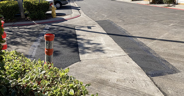 Asphalt paving to fix the potholes.