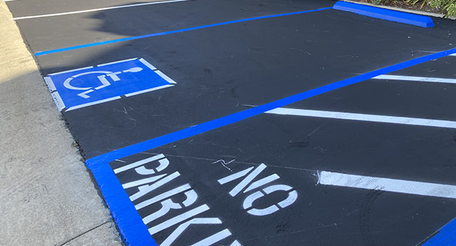 Showcasing the newly painted parking space and handicap sections.